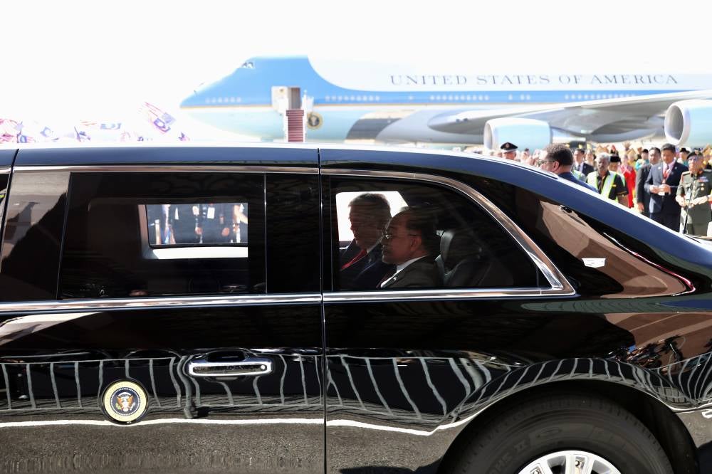 Prime Minister Datuk Seri Anwar Ibrahim and the United States President Donald Trump ride The Beast, the state car specially flown in for the visit, which will accompany President Trump throughout his stay in Malaysia. Photo by Bernama