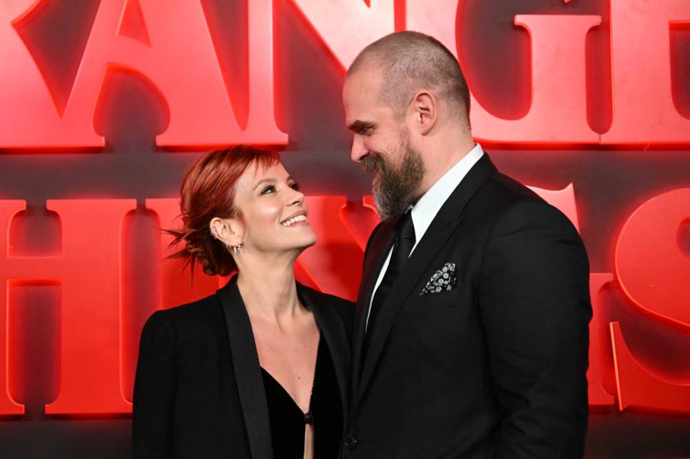 British singer Lily Allen and US actor David Harbour pose on the red carpet upon arrival to attend the West End world premiere of "Stranger Things: The Last Shadow" stage play at the Phoenix Threatre in central London on Dec 14, 2023. - (Photo by JUSTIN TALLIS / AFP)