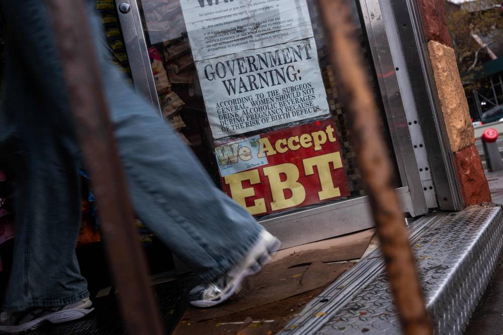 A store displays a sign accepting Electronic Benefits Transfer (EBT) cards for Supplemental Nutrition Assistance Programme (SNAP) purchases for groceries on Oct 30, 2025 in New York City. - (Photo by SPENCER PLATT / Getty Images via AFP)
