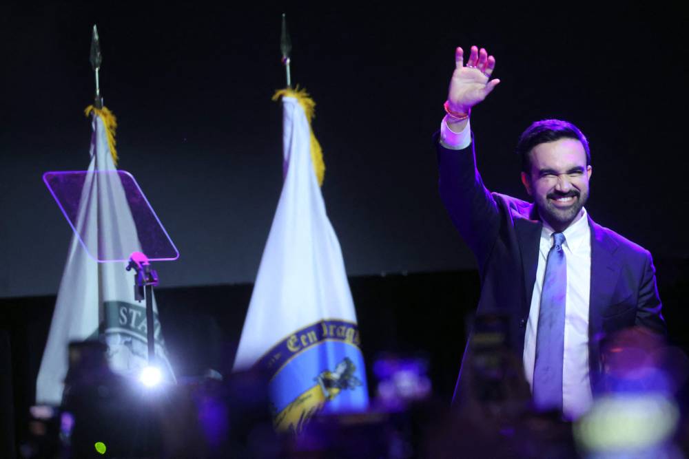 New York City Democratic mayoral candidate Zohran Mamdani celebrates as he takes the stage at his election night watch party at the Brooklyn Paramount on Nov 4. Photo by AFP