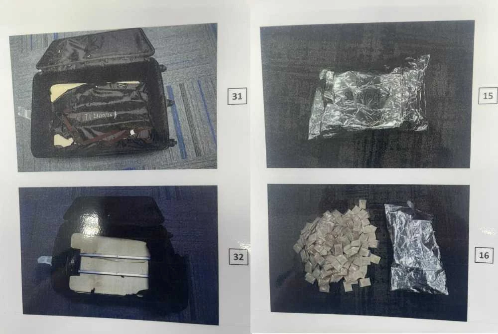 The inspection of the luggage found several small transparent plastic packages containing a powder suspected to be Ketamine, wrapped in aluminum foil, covered with cardboard, and hidden inside the cloth lining of the luggage bag. - Photo courtesy of RMCD