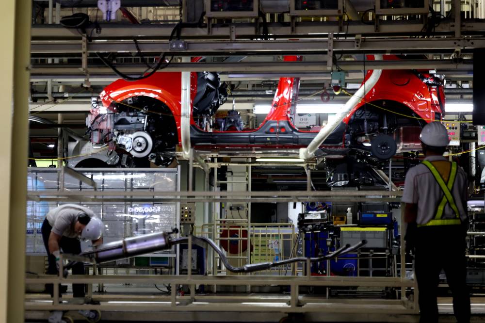 Car assembly operations at Perusahaan Otomobil Kedua Sdn Bhd (Perodua) here today. Photo by Bernama