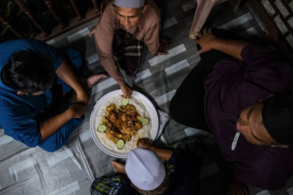 At Gubok Pawon, which means ‘charcoal kitchen hut’ in Javanese, 57-year-old Juriah Saian and her husband Arsad Bardan, 62, prepare the dish in a rustic wooden hut designed to resemble an old Malay village home - a setting far removed from the bustle of town life. - Bernama photo