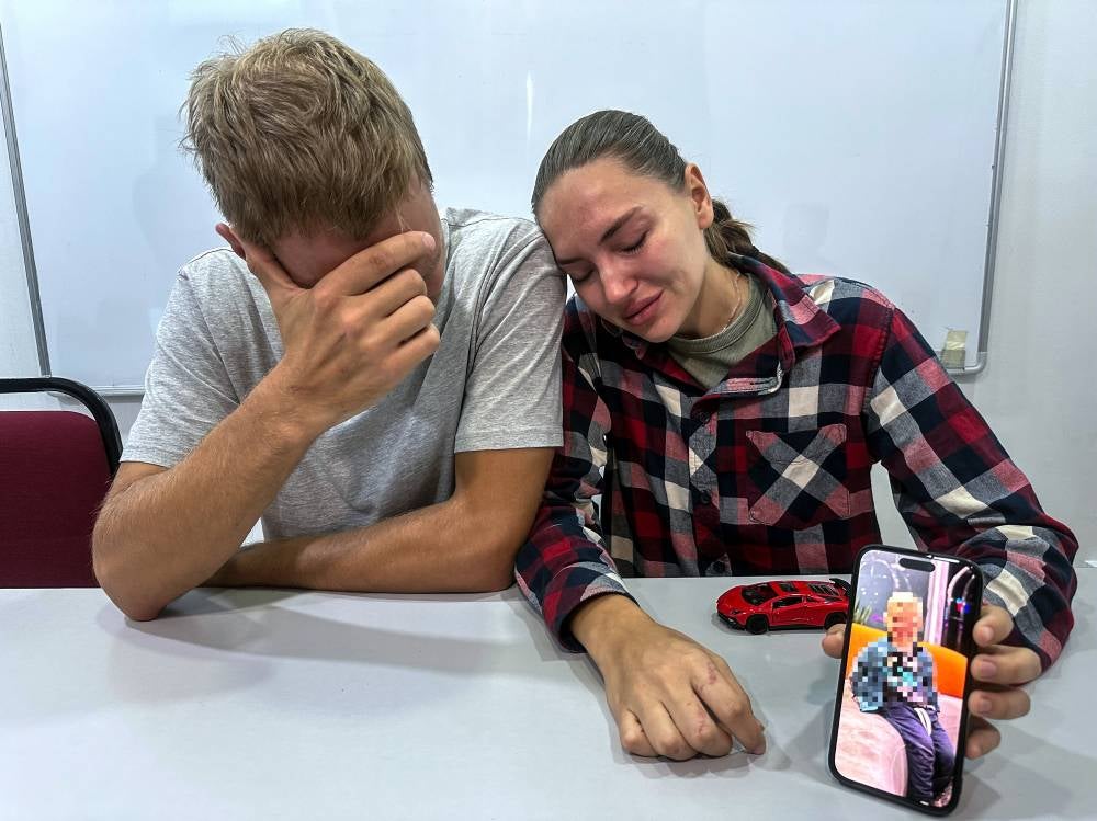 Russian couple Nikita Lakubanets, 32, and his wife Olga, 32, speaking at a press conference regarding the death of their two-year-old son, who was reportedly stung by a jellyfish at Chenang Beach, Langkawi, last Saturday. Photo by Bernama