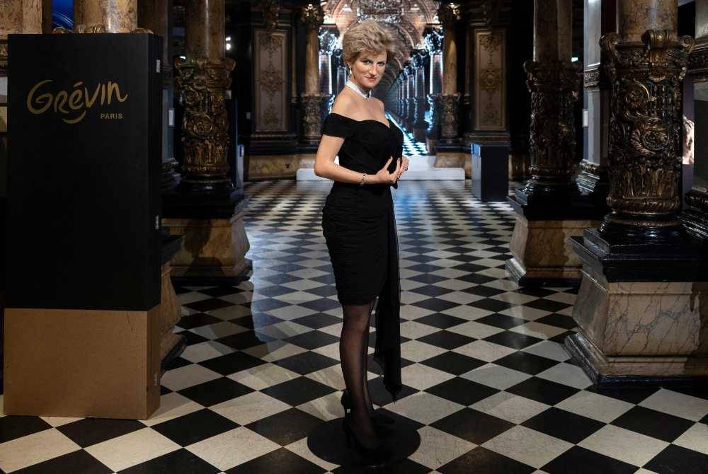 This photograph shows the wax effigy of Britain's late Princess Diana "Lady Di", wearing the "revenge dress" during its unveiling at the Musee Grevin in Paris on Nov 20, 2025. - (Photo by SEBASTIEN DUPUY / AFP)