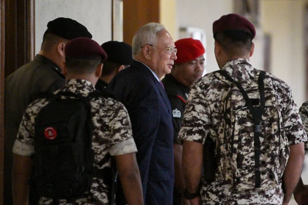 Datuk Seri Najib Razak at the Kuala Lumpur High Court for the hearing of his judicial review application over the purported existence of an addendum order on Nov 24, 2025. - Photo by Bernama