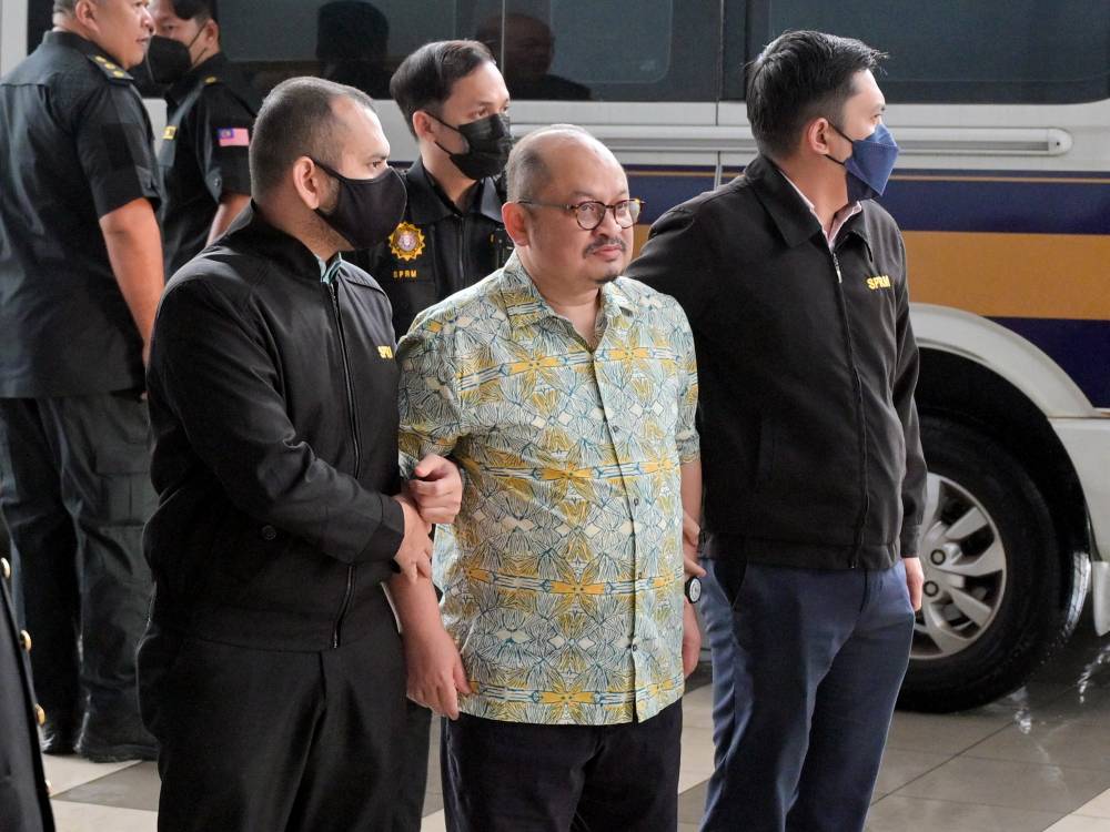Former Senior Political Secretary to the Prime Minister Datuk Seri Shamsul Iskandar Mohd Akin was charged in the Sessions Court here today with four counts of corruption amounting to RM176,829.03 in connection with mineral exploration licence approval in Sabah. Photo by Bernama