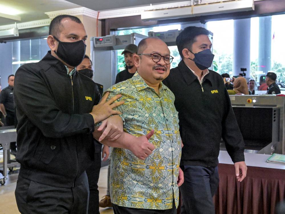 Former Senior Political Secretary to the Prime Minister Datuk Seri Shamsul Iskandar Mohd Akin was charged in the Sessions Court here today with four counts of corruption amounting to RM176,829.03 in connection with mineral exploration licence approval in Sabah. Photo by Bernama