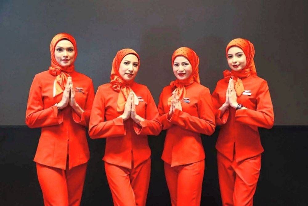 AirAsia announced that it has refreshed its cabin crew uniform policy, now permitting female staff to wear the hijab while on duty. - Photo courtesy of AirAsia