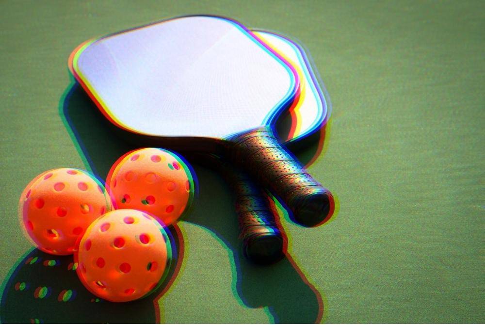 Pickleball players are encouraged to warm up properly, use the right gear, rest when needed, and know their limits. Photo for illustrative purposes only. Photo: Edited via Canva