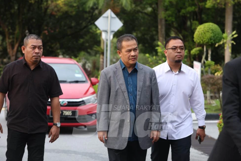 Azman (second from left) is accused of directing the KAHB chief executive officer to issue a letter of offer to Mohd Hassanaim for the project.
