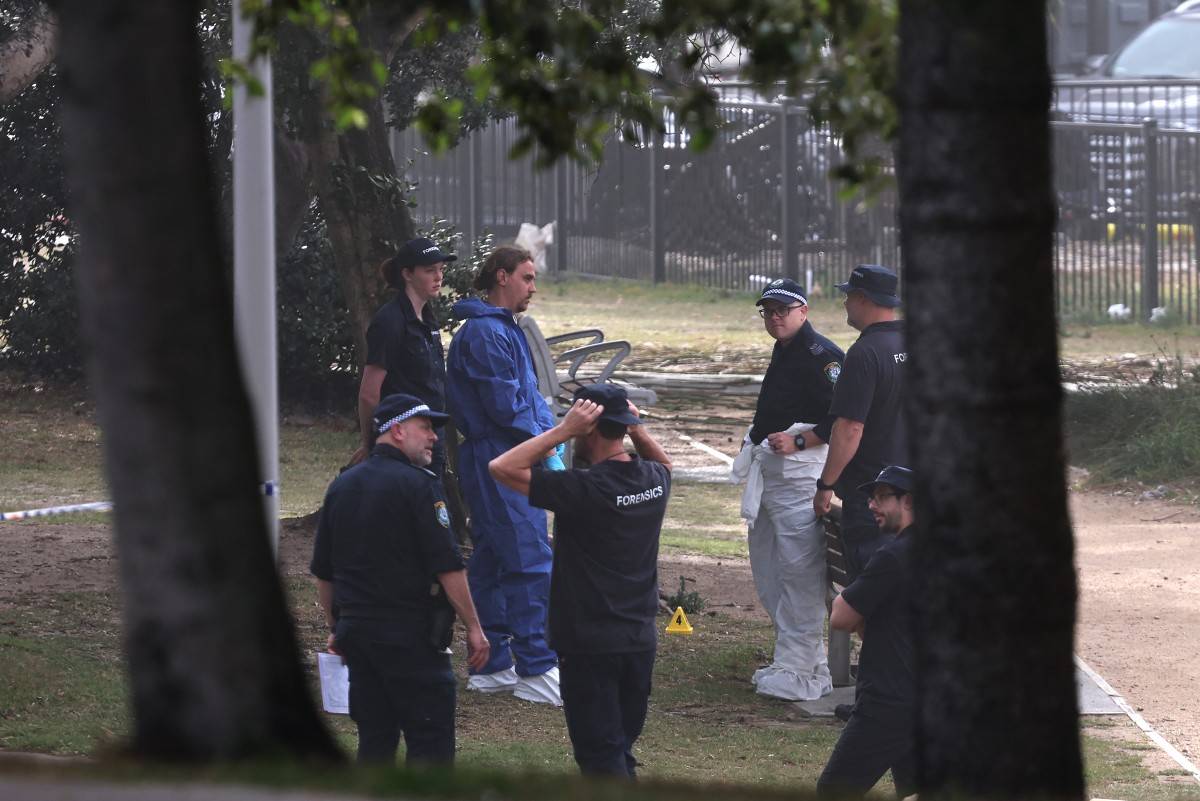 Forensic experts inspect at the scene of a shooting at Bondi Beach in Sydney on Dec 15, 2025. - (Photo by DAVID GRAY / AFP)
