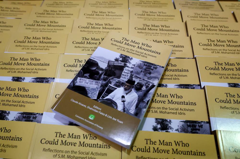 Copies of the book The Man Who Could Move Mountains: Reflections on the Social Activism of S.M. Mohamed Idris on sale at its launch event at the International Institute of Advanced Islamic Studies (IAIS) Malaysia on Monday.
