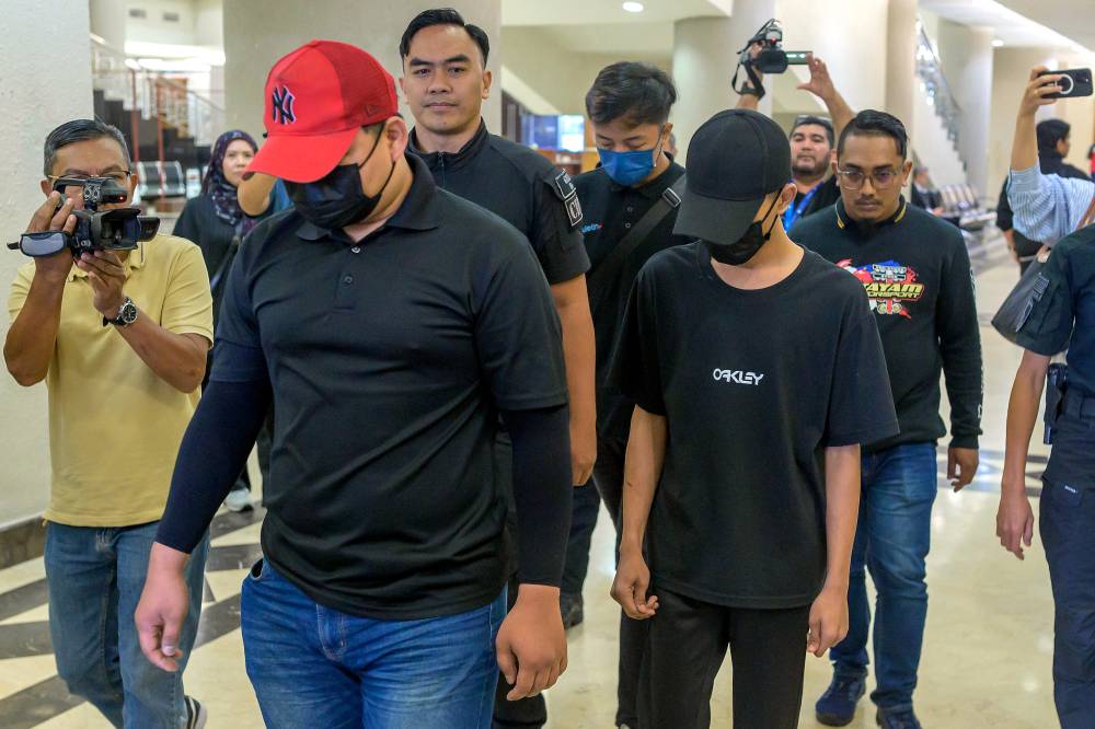According to the charge, the teenager was accused of voluntarily causing hurt to intimidate Sulizmie Affendy while he was carrying out his duties as the commanding officer. - Bernama photo