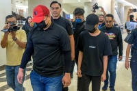 According to the charge, the teenager was accused of voluntarily causing hurt to intimidate Sulizmie Affendy while he was carrying out his duties as the commanding officer. - Bernama photo