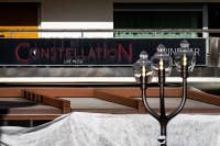 A photograph taken on January 1, 2026 shows the facade of the Constellation bar, following a fire that ripped through the venue in Crans-Montana, during New Year's Eve celebrations. (Photo by MAXIME SCHMID / AFP)