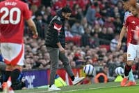 Manchester United's Portuguese head coach Ruben Amorim controls the ball on the touchline during the English Premier League football match between Manchester United and Arsenal at Old Trafford in Manchester, north west England, on March 9, 2025. (Photo by Paul ELLIS / AFP) 
