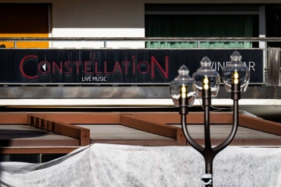 A photograph taken on January 1, 2026 shows the facade of the Constellation bar, following a fire that ripped through the venue in Crans-Montana, during New Year's Eve celebrations. (Photo by MAXIME SCHMID / AFP)