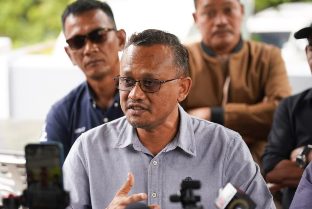 Sariman speaks during a press conference at a restaurant on Tuesday.