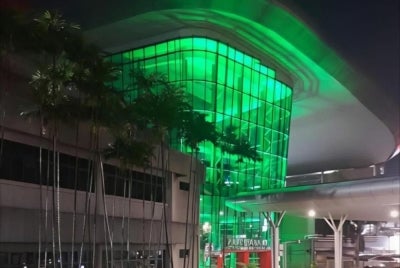 Universiti Malaya Medical Centre at night, with green light shining from the building. - Source: @Universitimalayamedicalcentre (Faceboook)