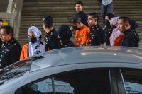 The three suspects were brought to court at about 10 am after being detained at the MACC headquarters yesterday evening. - Bernama photo