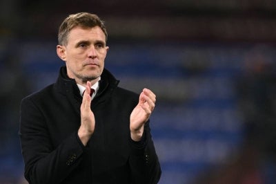 Manchester United's Scottish Interim head coach Darren Fletcher applauds the travelling fans at the end of the English Premier League football match between Burnley and Manchester United at Turf Moor in Burnley, north-west England on January 7, 2026. (Photo by Oli SCARFF/AFP)