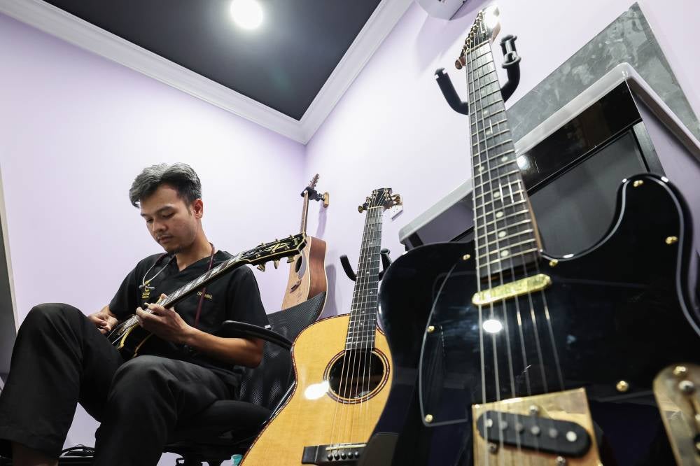 Dr Amirul is not only known as a young doctor who has successfully expanded his clinic network, but is also recognised among patients and colleagues as a physician who embraces music. - Bernama photo
