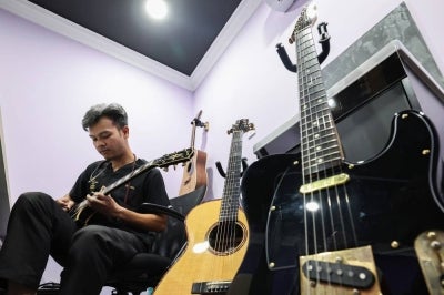 Dr Amirul is not only known as a young doctor who has successfully expanded his clinic network, but is also recognised among patients and colleagues as a physician who embraces music. - Bernama photo
