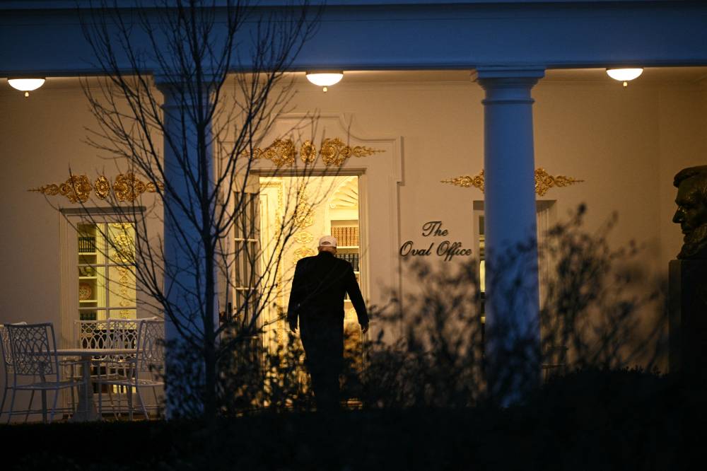 US President Donald Trump walks to the Oval Office at the White House in Washington, DC, on January 13, 2026. Trump traveled to Detroit, Michigan, to speak to the Detroit Economic Club and visit a Ford production plant. (Photo by Brendan SMIALOWSKI / AFP)