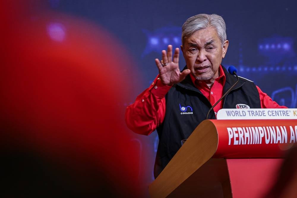 Umno president Datuk Seri Ahmad Zahid Hamidi delivering his speech at the Politics in Digital Era Symposium 2026 programme in conjunction with the 2025 Umno General Assembly, today. - Bernama photo