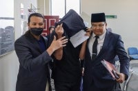 Mohd Lukman Mohamad Aluddin, 33, pleaded not guilty today at the Syariah High Court here to charges of cross-dressing and behaving like a woman last year. Photo by Bernama