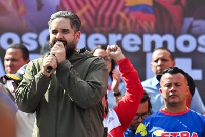 Deputy Nicolas Maduro Guerra, son of ousted President Nicolas Maduro, speaks during a march in Caracas on Jan 13, 2026, to demand the release of Maduro and his wife Cilia Flores, snatched and taken to New York on Jan 3 to face trial on drug and weapons charges. - (Photo by JUAN BARRETO / AFP)