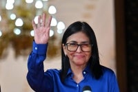 Venezuela's interim President Delcy Rodriguez waves after a press conference at the Miraflores Presidential Palace in Caracas on Jan 14, 2026. - (Photo by JUAN BARRETO / AFP)