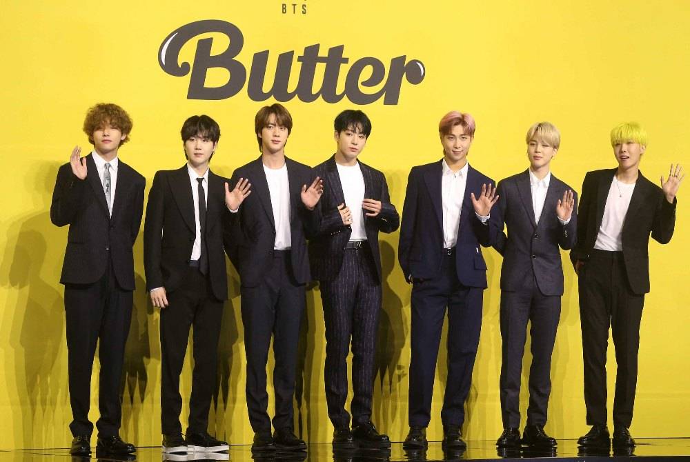 Members of South Korean K-pop boy band BTS pose for photographs during a press conference to promote their new single album 'Butter' in Seoul on May 21, 2021. - (Photo by Dong-A Ilbo / AFP)
