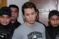 Chia Tong Hong was charged with murdering his wife, Phun Lai Ling, 37 and their five-year-old son, Aaden Chia Yee Heng. Photo by Bernama