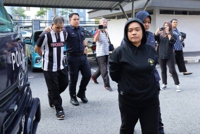 A woman pleaded not guilty at the Sessions Court here today to a charge of neglecting her biological child, while her boyfriend was charged with causing injury to the victim. Photo by Bernama
