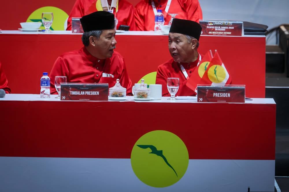 Datuk Seri Ahmad Zahid Hamidi (right), and Mohamed - Bernama photo
