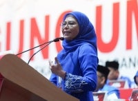 Noraini during winding-up speech at 2025 Umno General Assembly. (Photo by Rosli Talib)