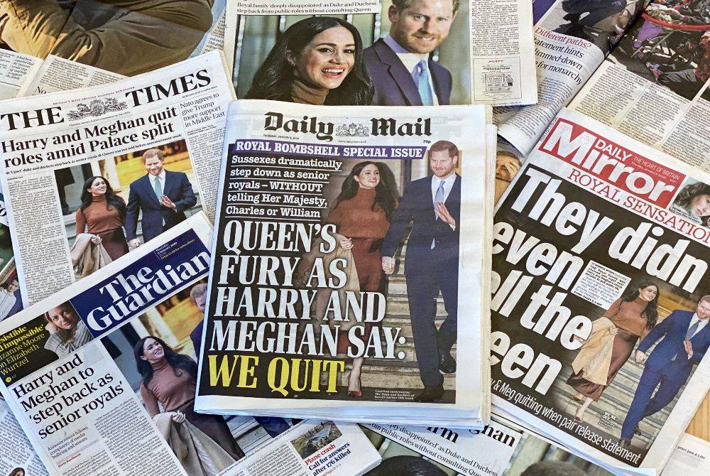 An arrangement of UK daily newspapers photographed as an illustration in London on Jan 9, 2020, shows front page headlines reporting on the news that Britain's Prince Harry, Duke of Sussex and his wife Meghan, Duchess of Sussex, plan to step back as "senior" members of the Royal Family. - (Photo by DANIEL LEAL / AFP)