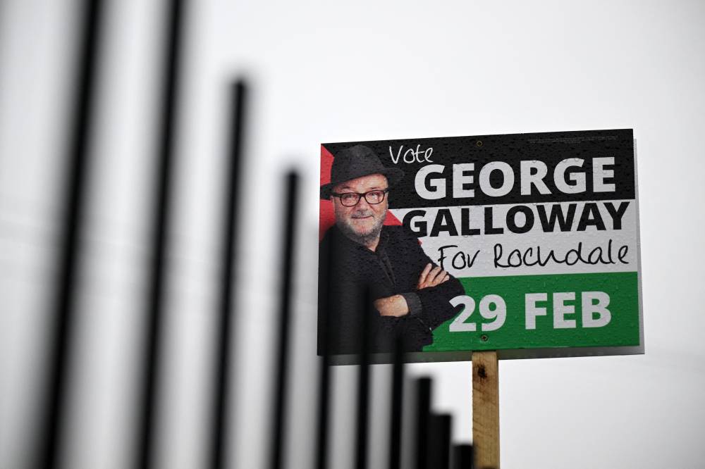 Promotional signs for Workers Party candidate George Galloway are pictured in Rochdale, northern England on March 1, 2024, the day after Galloway was elected as MP for Rochdale following a by-election. (Photo by Oli SCARFF / AFP)