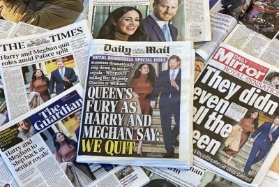 An arrangement of UK daily newspapers photographed as an illustration in London on Jan 9, 2020, shows front page headlines reporting on the news that Britain's Prince Harry, Duke of Sussex and his wife Meghan, Duchess of Sussex, plan to step back as "senior" members of the Royal Family. - (Photo by DANIEL LEAL / AFP)