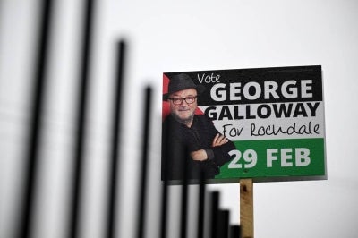 Promotional signs for Workers Party candidate George Galloway are pictured in Rochdale, northern England on March 1, 2024, the day after Galloway was elected as MP for Rochdale following a by-election. (Photo by Oli SCARFF / AFP)
