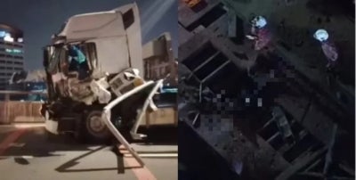 Two men were killed after falling from the Setiawangsa-Pantai Expressway (SPE) near Jalan Empat off Jalan Chan Sow Lin here last night, when their trailer lorry crashed into a road barrier. Photo: Social media