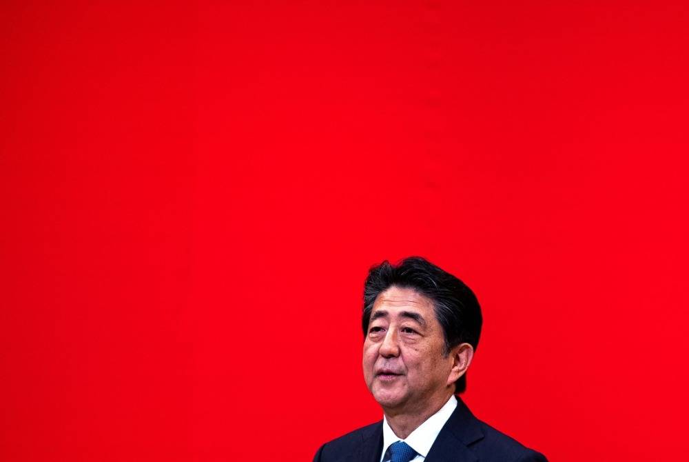 In this picture taken on July 24, 2019 Japanese Prime Minister Shinzo Abe speaks on the podium during a ceremony marking one year before the start of the Tokyo 2020 Olympic Games in Tokyo. Photo by Behrouz Mehri/AFP FILE PIX