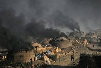 This photograph taken on Jan 10, 2026 shows smoke billowing from kilns at a potters' colony in Karachi. - (Photo by ASIF HASSAN / AFP)