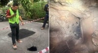 A sinkhole that appeared on Jalan Kenyalang 1 in Bayan Lepas on Monday is believed to have been caused by a leaking underground utility pipe. - Bernama photo