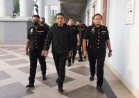Former Army Chief Tan Sri Hafizuddeain Jantan and his wife Salwani Anuar were charged at the Kuala Lumpur Special Corruption Court today with four counts related to money laundering.