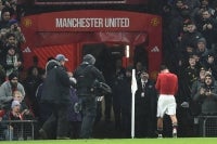 Manchester United's English midfielder #61 Shea Lacey walks down the tunnel having been sent off during the English FA Cup third round football match between Manchester United and Brighton and Hove Albion at Old Trafford Stadium in Manchester, north west England, on January 11, 2026. (Photo by PETER POWELL/AFP)