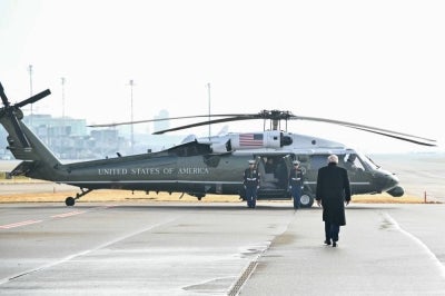 US President Donald Trump walks on the tarmac upon arrival at Zurich Airport to board the Marine One helicopter en route Davos where he will attend the World Economic Forum on January 21, 2026. The World Economic Forum takes place in Davos from January 19 to January 23, 2026. (Photo by Mandel NGAN / AFP)