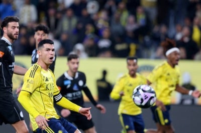 Nassr's Portuguese forward #07 Cristiano Ronaldo eye the ball during the Saudi Pro League football match between al-Nassr and al-Shabab at al-Awwal Park stadium, in Riyadh on January 17, 2026. (Photo by Fayez Nureldine / AFP)